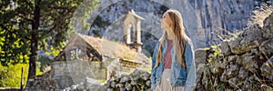 BANNER, LONG FORMAT Woman tourist enjoys the view of Kotor. Montenegro. Bay of Kotor, Gulf of Kotor, Boka Kotorska and