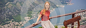 BANNER, LONG FORMAT Woman tourist enjoys the view of Kotor. Montenegro. Bay of Kotor, Gulf of Kotor, Boka Kotorska and