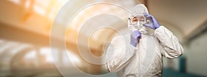 Banner of Male Chinese Doctor or Nurse Wearing Protective Face Mask and Surgical Gloves In Hospital