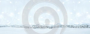 Banner. New year and Christmas background with silver garlands with lights with bokeh in blur. Gray neutral colors with