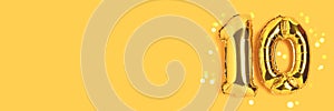 Banner with number 10 golden balloons with place for text.