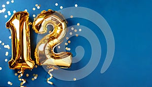 Banner with number 12 golden balloon with copy space. 12 years anniversary celebration