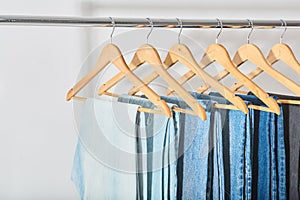 banner of online store. clothes rail with blue, blue and gray jeans