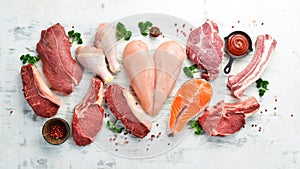 Banner. Raw meat steaks salmon, beef and chicken on a white wooden background. Organic food.