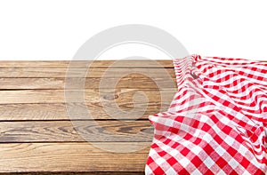 Banner of Red Checkered tablecloth top view  on white background. Brown wooden table. Selective focus. Copy space. Place