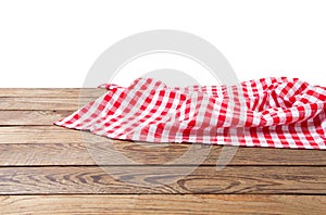 Banner of Red Checkered tablecloth top view  on white background. Brown wooden table. Selective focus. Copy space. Place