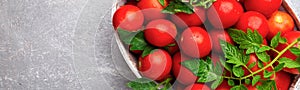 Banner of Red tomato in grey basket on grey background