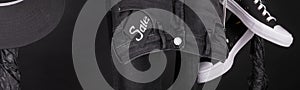 Banner with Sale sign, Black and white snaekers, cap and pant, jeans