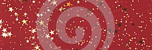 Banner with shiny golden stars and crystals confetti on a red background.