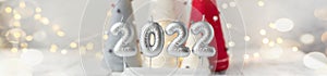 Banner with silver numbers 2022. Bokeh effect on background. New year celebration. Happy New Year concepts