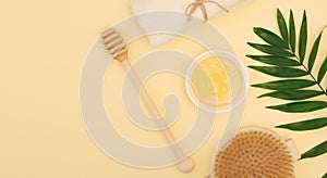 Banner of spa treatments for relaxation and weight loss. Natural honey, honey dipper, dry body massage brush, white