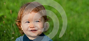 Banner with spring child face. Lifestyle portrait baby child in happines at the outside in the meadow. Baby face close