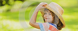 Banner with spring child face. Portrait of cheerful child in summer nature park. Cute joyful little boy kid. Close up