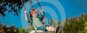 Banner with spring child face. Child swing on backyard. Kid playing oudoor. Happy cute little boy swinging and having photo