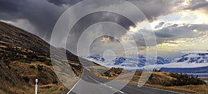 Banner of traveling  explore on the road with  ray light as mountain range near Aoraki Mount Cook and the road leading to Mount
