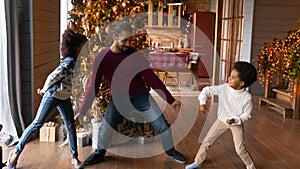 Banner view of biracial dad with kids dancing