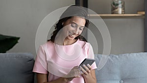 Banner view of smiling ethnic woman use smartphone