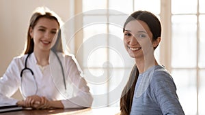 Banner view of smiling female patient at consultation