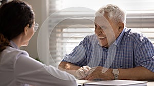 Banner view of smiling senior patient at hospital consultation
