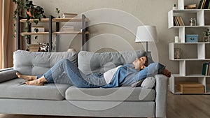 Banner view of woman lying on couch sleeping