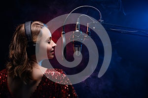 Banner for vocal lessons and music. A professional singer sings into a studio microphone. Screensaver for karaoke and vocal