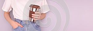 Banner with woman hold in hands reusable coffee cup.