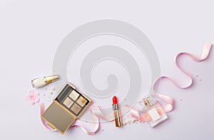 Banner of woman`s cosmetics on purple background.