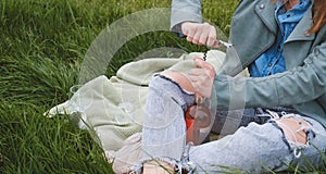 Banner Woman uncork the bottle outdoors,