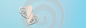 Banner with wooden hearts on a blue background