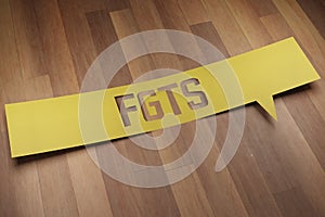 Banner with the word `FGTS` in speech bubble. 3D Render photo