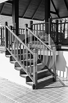Bannister shadow on wooden stair step photo