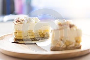 2 Banoffee pie with chocolate powder on wooden plate photo