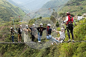 Group of people on suspension bridge, Ecuador