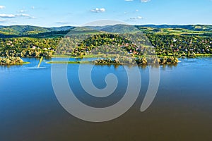 Banostor, a village in Serbia in the Vojvodina province on right riverbank of Danube river on sunny summer day, aerial view