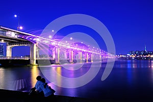 Banpo bridge rainbow fountain show at night in Seoul, Soth Korea.