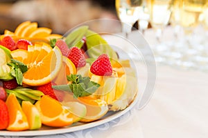 Banquet fruit plate and champagne glasses