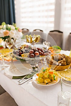 Banquet table with food and snacks at a wedding, birthday or party photo