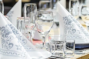Banquet table with wineglasses and serviettes