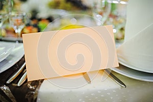 Banquet wedding invitation on table setting on evening reception