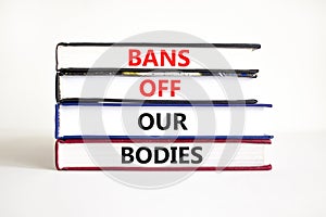 Bans off our bodies symbol. Concept words Bans off our bodies on books on a beautiful white table white background. Women rights