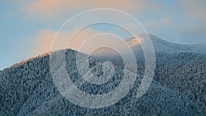 Bansko, Bulgaria. Snow mountain peak at sunrise