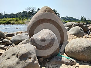 Banten, Indonesia. 29th of July 2021. The stones lied beside the river