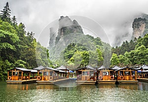 Baofeng Lake Boat Trip in a rainy day with clouds and mist at Wulingyuan, Zhangjiajie National Forest Park, Hunan Province, China, photo