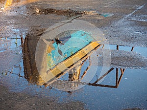 Baot reflection on the port sidewalk