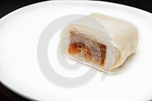 Baozi or Mantou, dim sum-Chinese steamed meat bun serving on white plate