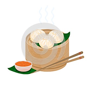 Baozi steamed chinese buns. Momo dumplings in a bamboo wooden steamer basket