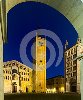 Baptistery and cathedral of Parma illuminated at evening