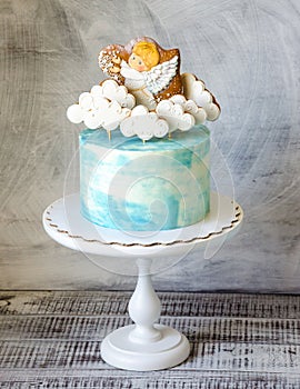 Baptizing blue cream cake with gingerbread cookies