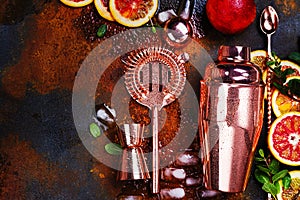 Bar accessories, drink tools and cocktail ingredients on rusty stone table. Flat lay style