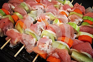 Bar-B-Q or barbecue with kebab cooking. charcoal grill chicken skewers with mushrooms, peppers and carrots.